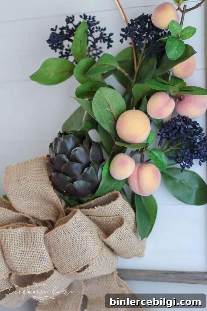 Gorgeous fall wreath with fruit on a "shiplap" framed backdrop.