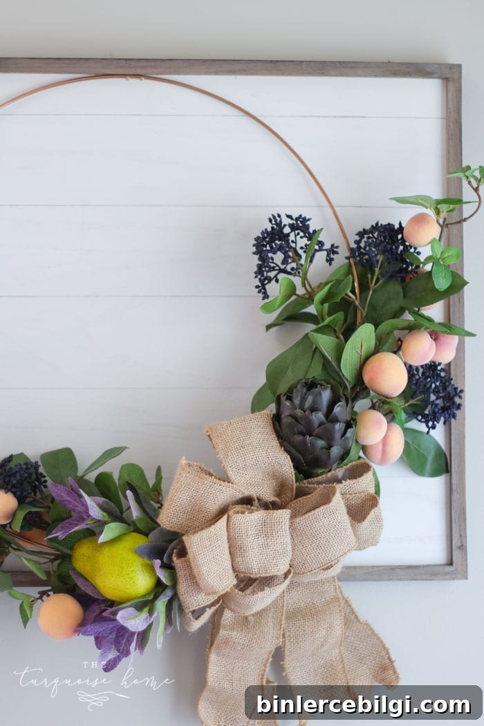 Hang the gorgeous fall fruit wreath on the framed "shiplap" board!