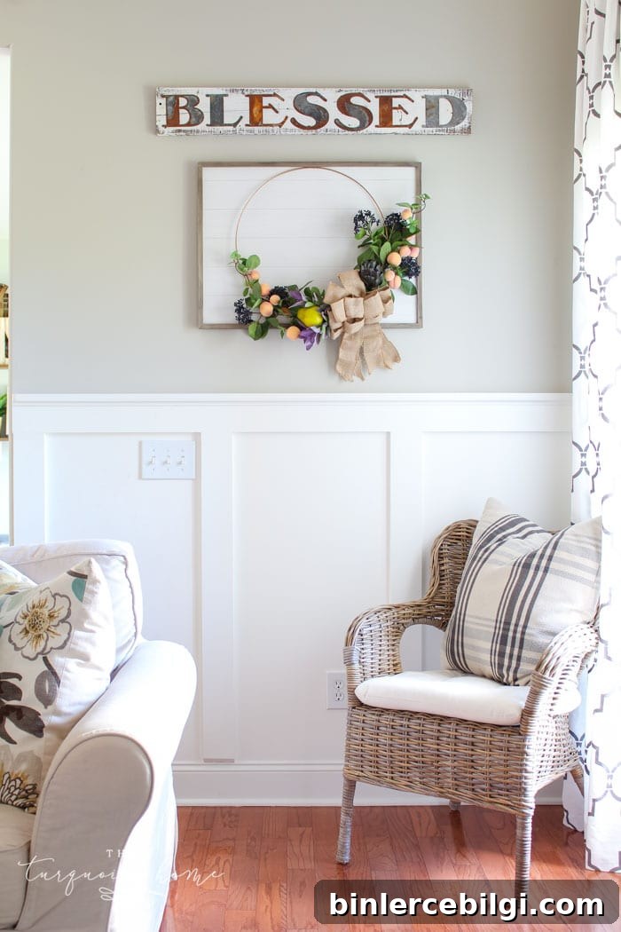 Gorgeous fall wreath with fruit on a "shiplap" framed backdrop.