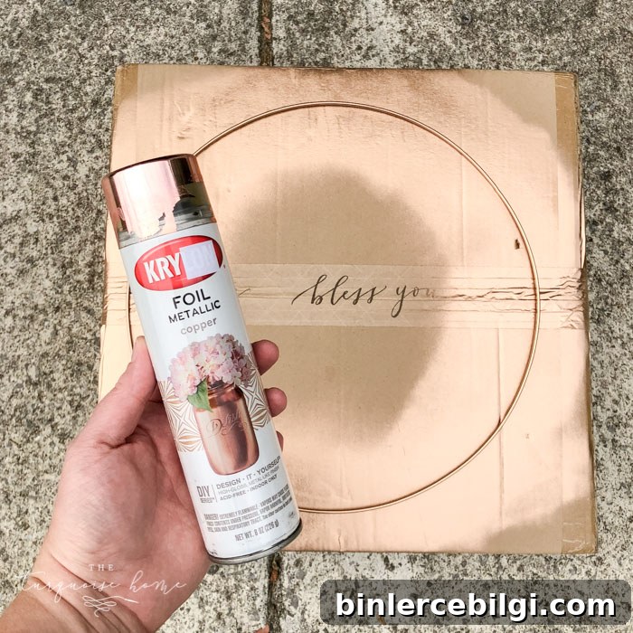 Spray paint the wreath hoop with copper metallic spray paint. 