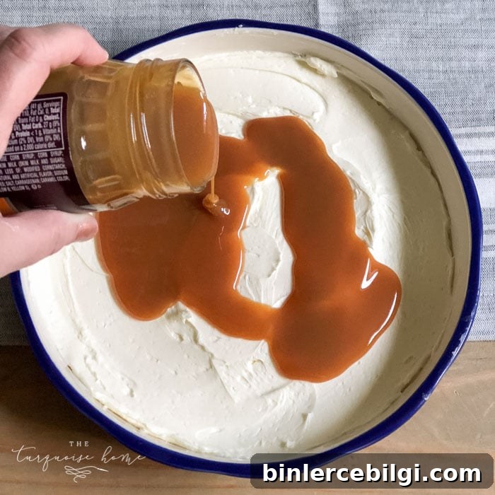 Pour the caramel sauce over the cream cheese spread. | Cream Cheese Caramel Apple Dip Recipe