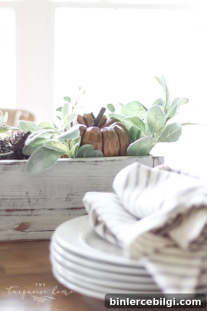 My favorite wooden pumpkin sitting in a bed of lamb's ear leaves. Perfect for a fall centerpiece!