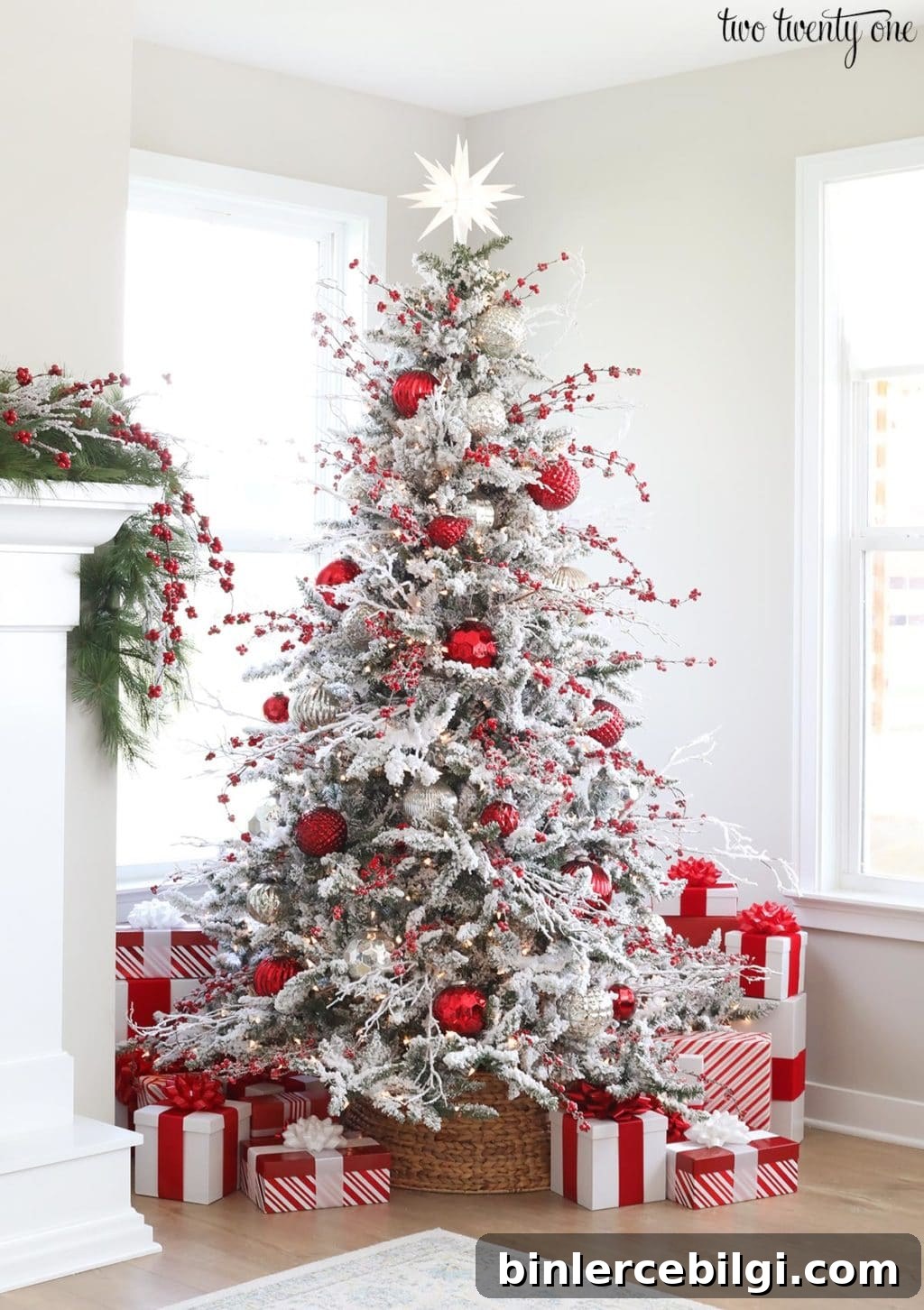Red and white flocked Christmas tree with berry stems