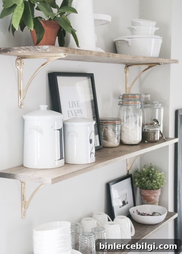 brass hardware and light stain on open shelves.
