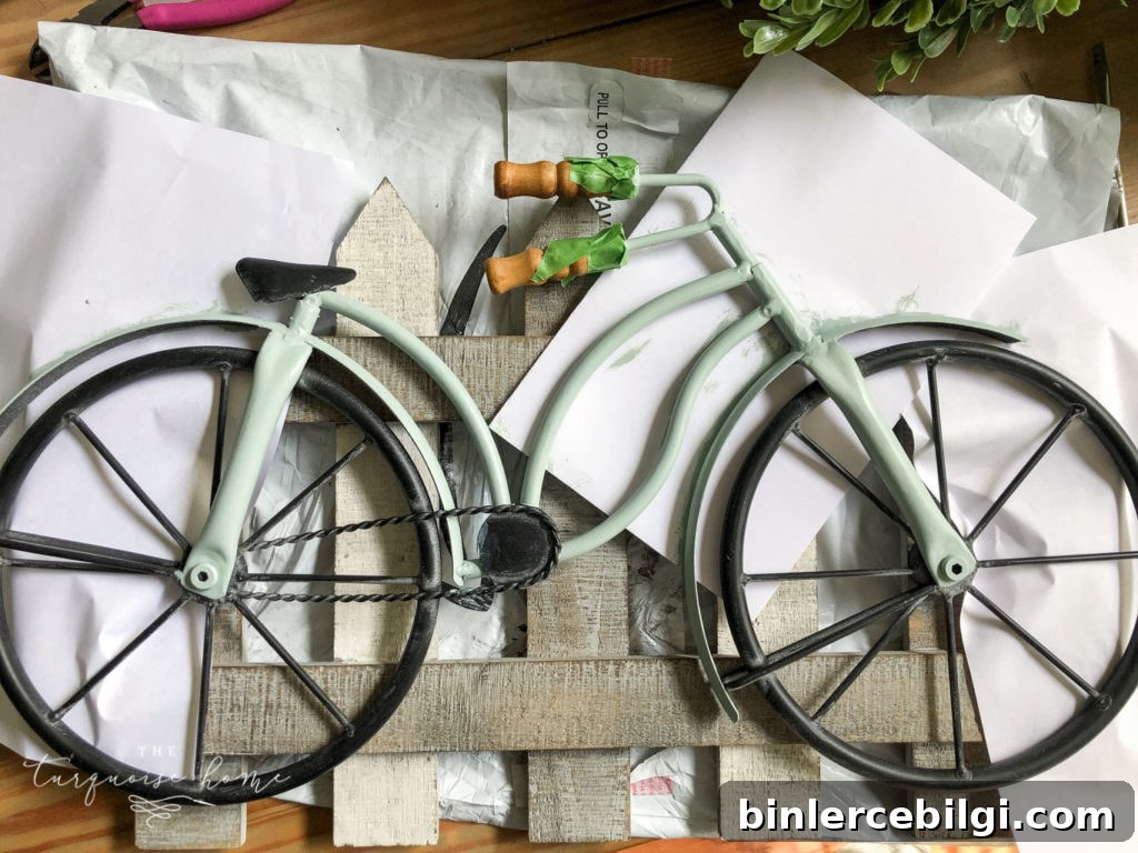 DIY Boxwood Bicycle Wheel Wreath for Front Door 5 DIY Boxwood and Bicycle Spring Wreath - use paper to protect your fence while painting the bike