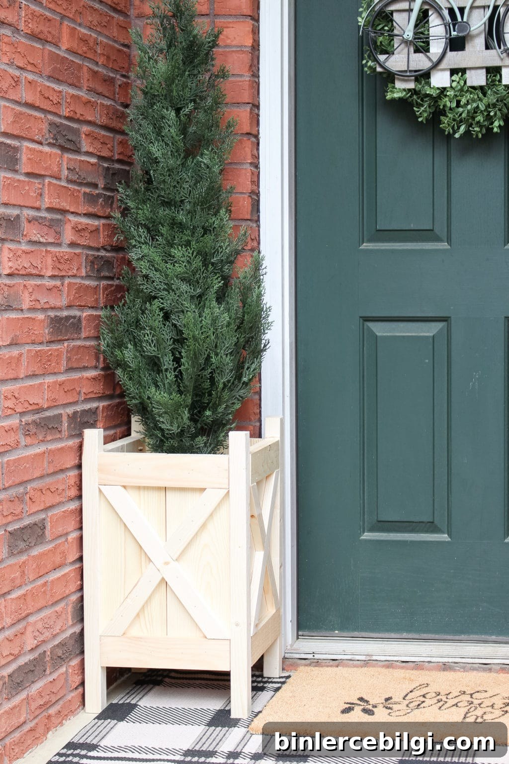 Completed DIY wood planter box on front porch