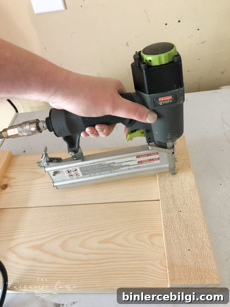 Add the 11 inch boards to the top of 2 side panels and nail them in