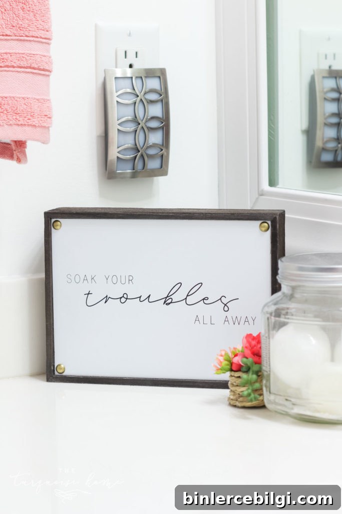 How to Create Big Style in a Small Bathroom | The Girls' Bathroom Refresh Reveal  | Soak Your Troubles All Away Sign