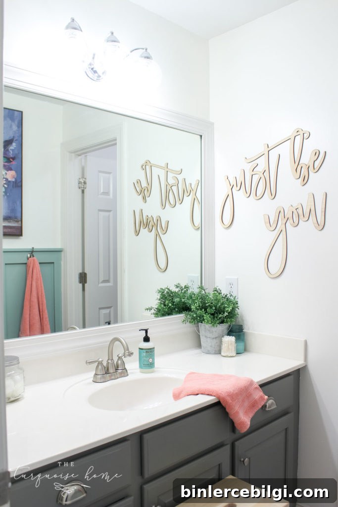 Window arch above the toilet in the girls' bathroom refresh | Use a basket for toilet paper storage and a over-the-toilet cabinet if needed | bathroom makeover