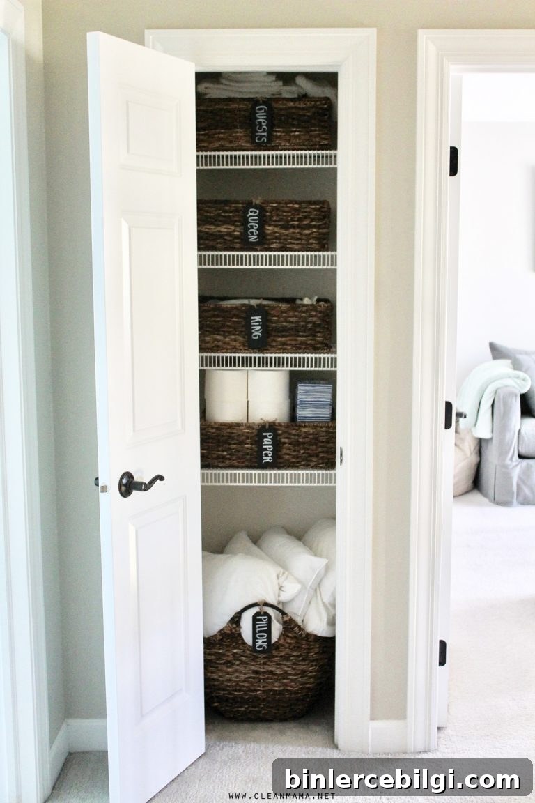 Labeled baskets in a linen closet