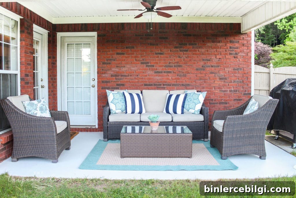 How to Paint a Concrete Patio for Long-Lasting Results 8 How to Paint a Concrete Patio - with full chairs and rug in it after it was painted
