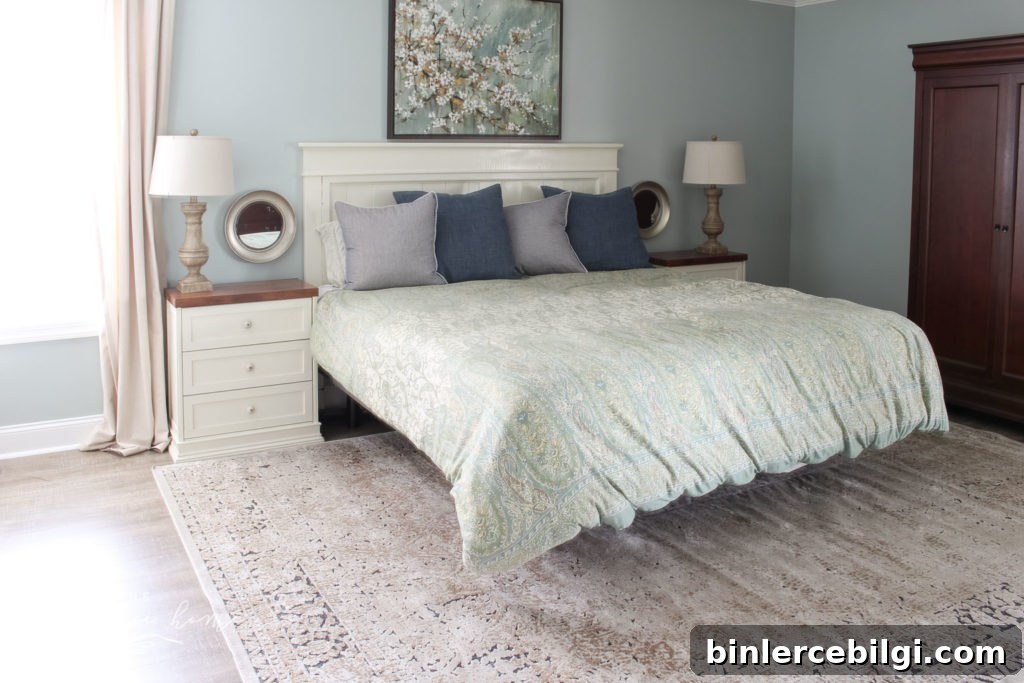 Gorgeous Ivory and Beige Antique-style Rug in a Farmhouse Master Bedroom. What size rug to buy for a king bed?