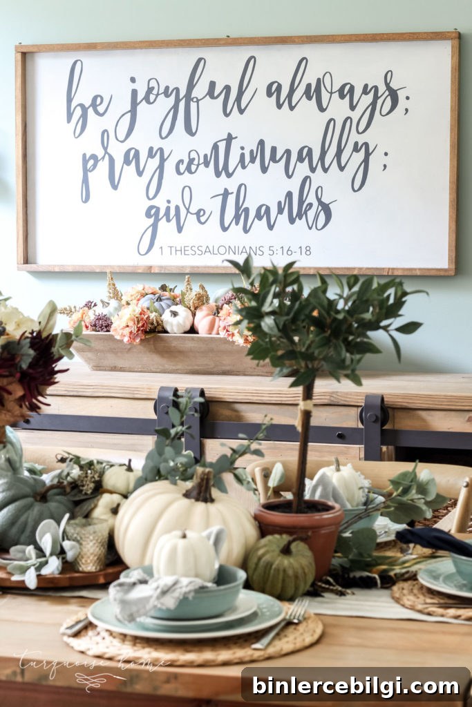 Pumpkins and Greenery Fall Tablescape with bay leaves in a pot and fall floral arrangement.