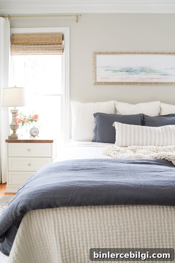 Farmhouse Bedding Ideas to Transform Your Bedroom 3 Master Bedroom with Abstract Art Above the Bed