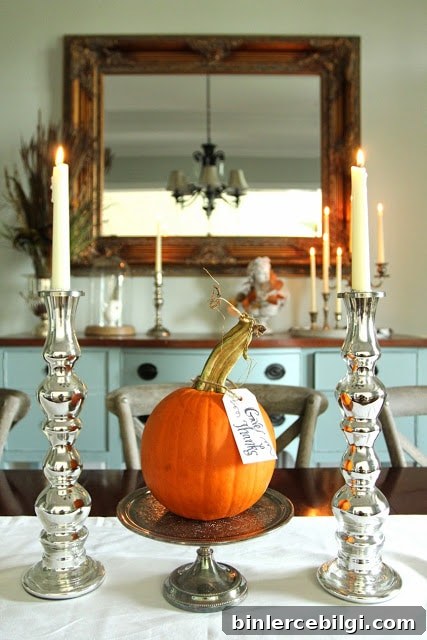 use large silver candlesticks for thanksgiving table decor
