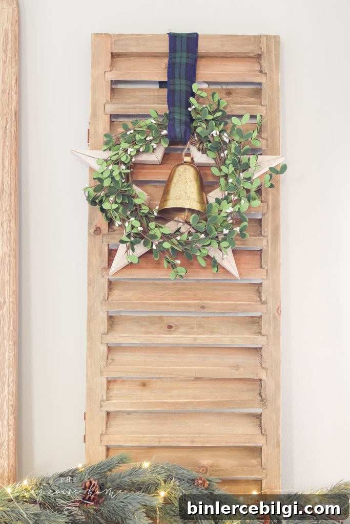 Green and Navy Simple Christmas Mantel - shutter with wooden star, wreath and bell. 