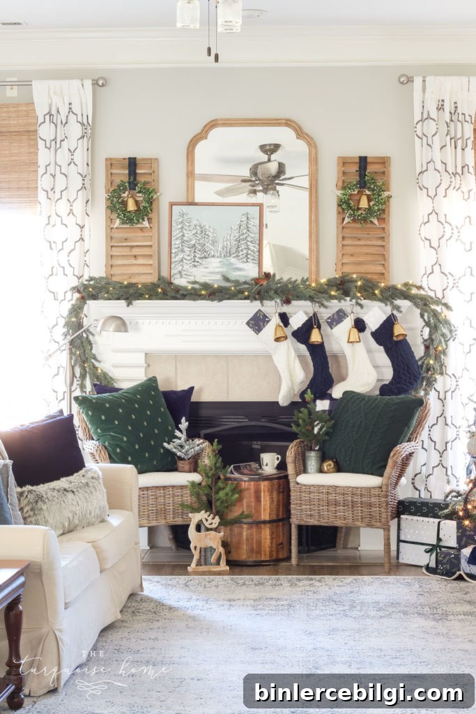 Green and Navy Simple Christmas Mantel - pretty gold bells, cable knit stockings and beautiful velvet pillows