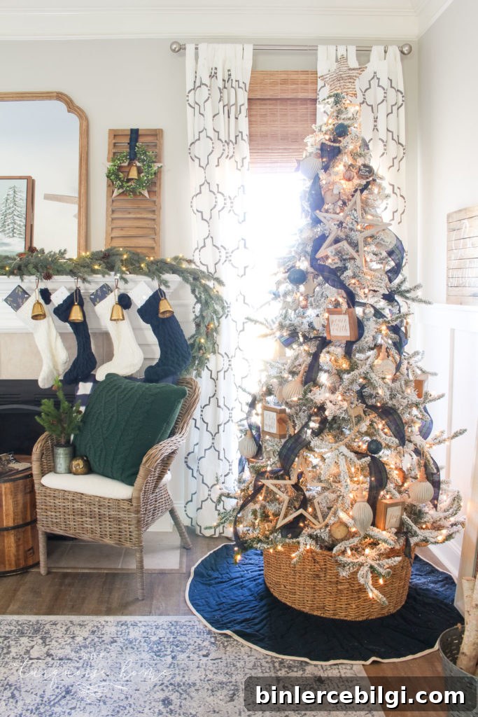 Pretty Christmas tree with flocking and neutral ornaments and navy and green decor!