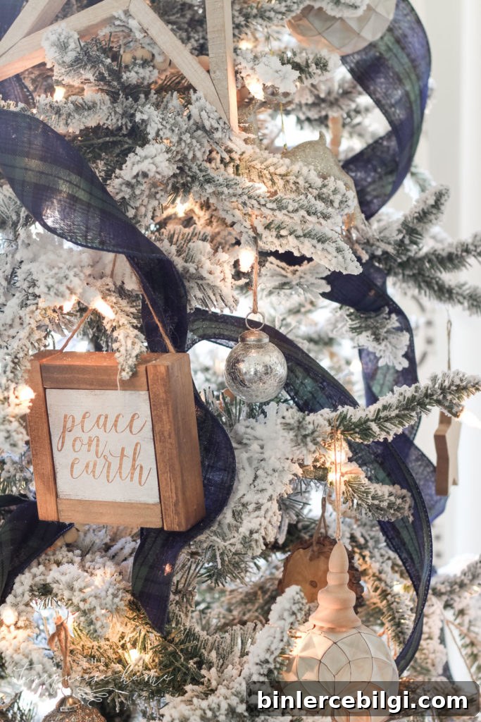 Blue and Green Plaid Ribbon on a Flocked Christmas Tree