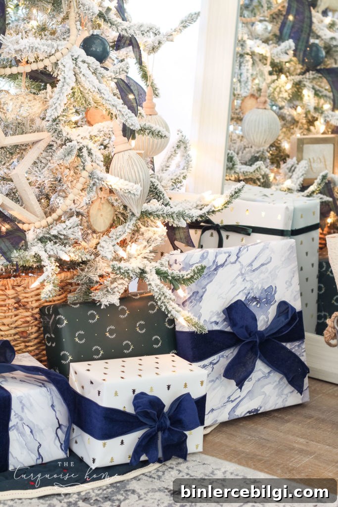 Beautiful blues and greens in the wrapping paper coordinate perfectly with the Christmas decor! Flocked Christmas Tree with Navy and Green plaid ribbon