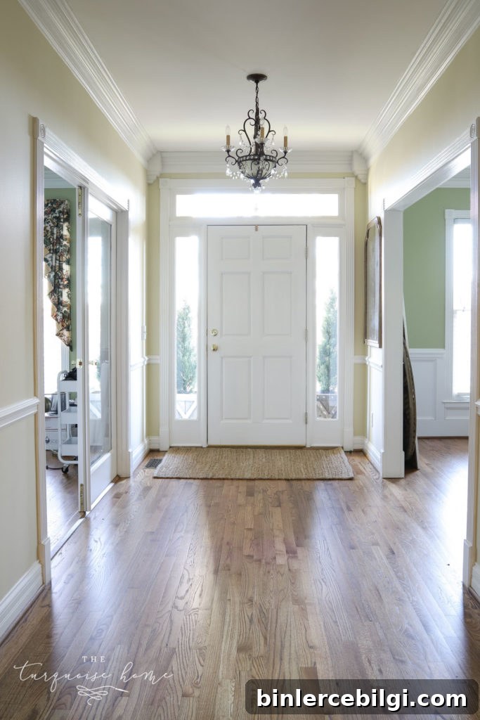Entry way in new house with brown hardwood floors. 