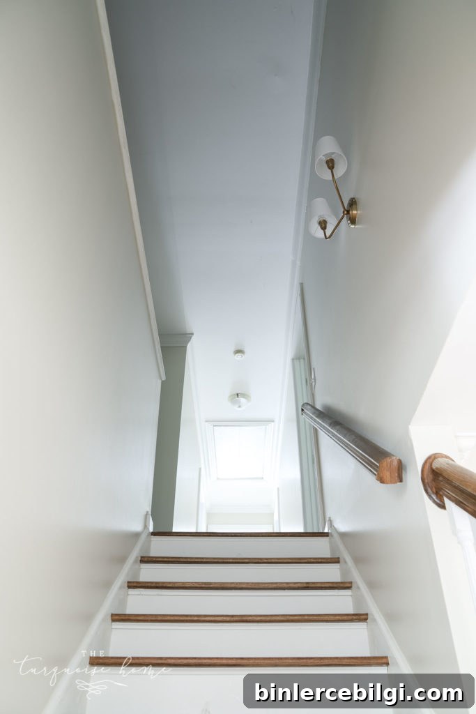 New Stairwell Lighting: Brass Double Sconce - Modern Sconce Lighting for Every Budget - leading up the stairs