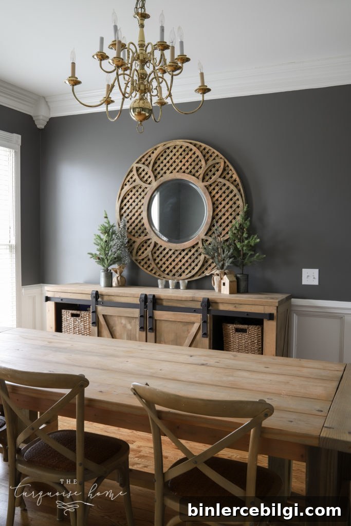 Kendall Charcoal dining room walls with wood buffet and large round mirror