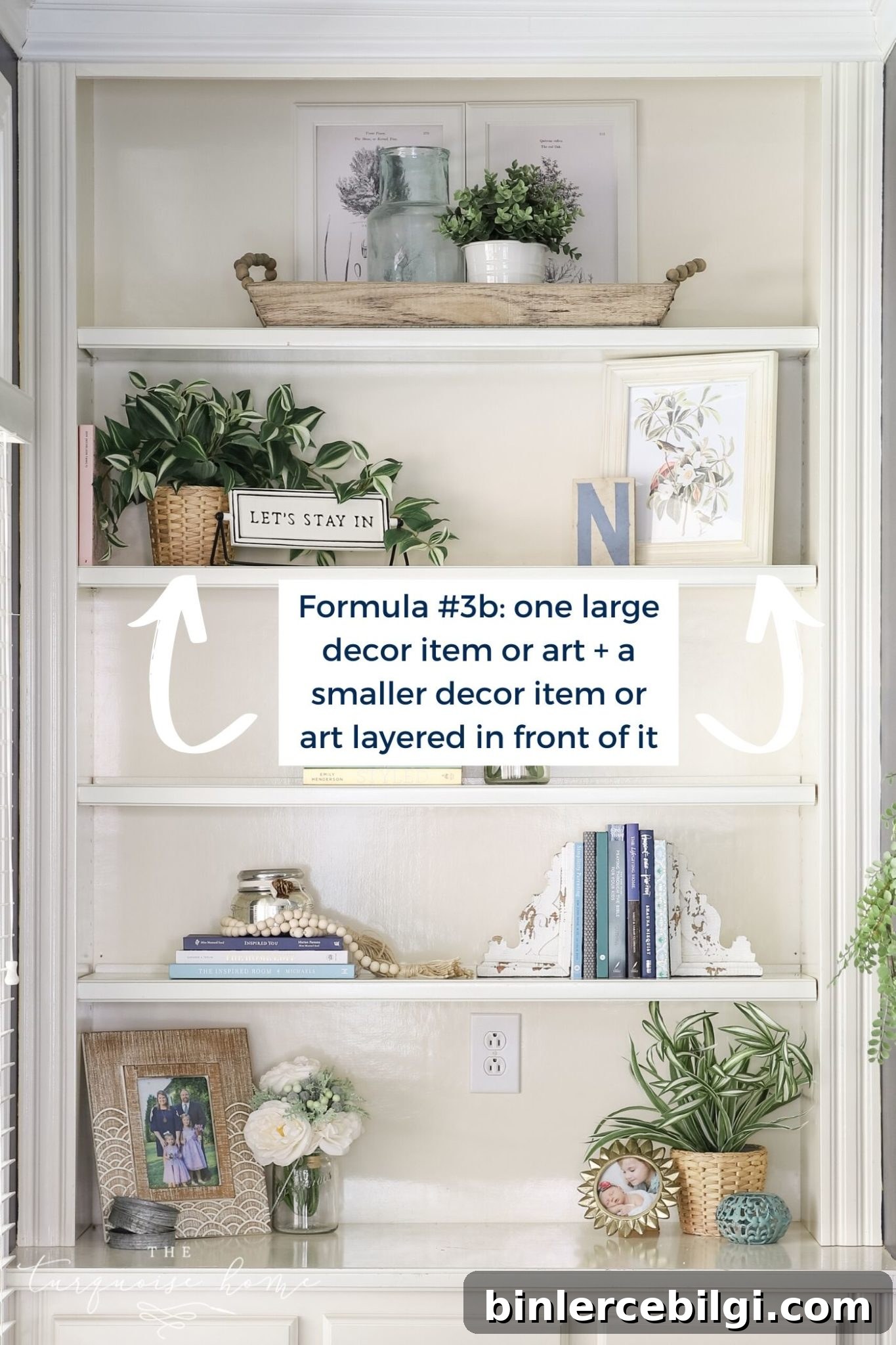 White built-in bookshelves with greenery, art and books!