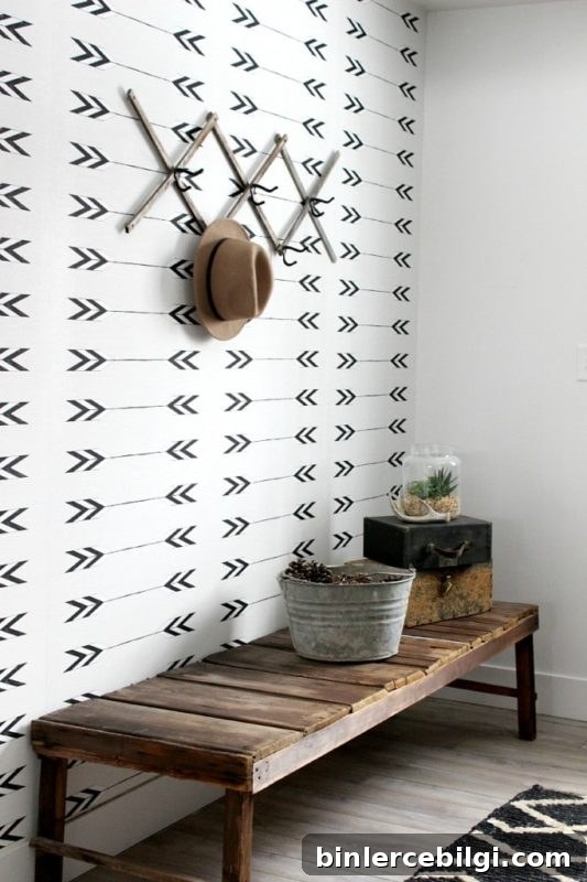 hallway with wooden bench and patterned wallpaper