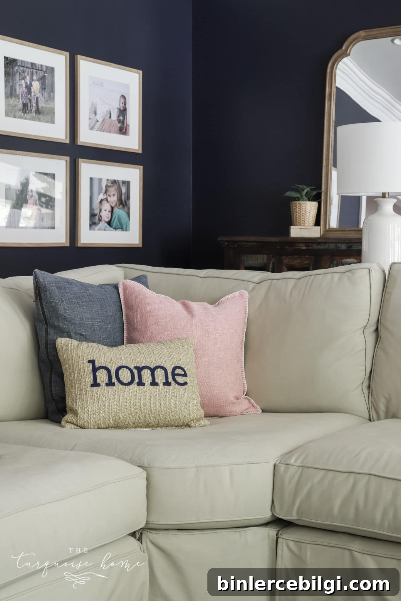 Two large square pillows with a bolster pillow in front