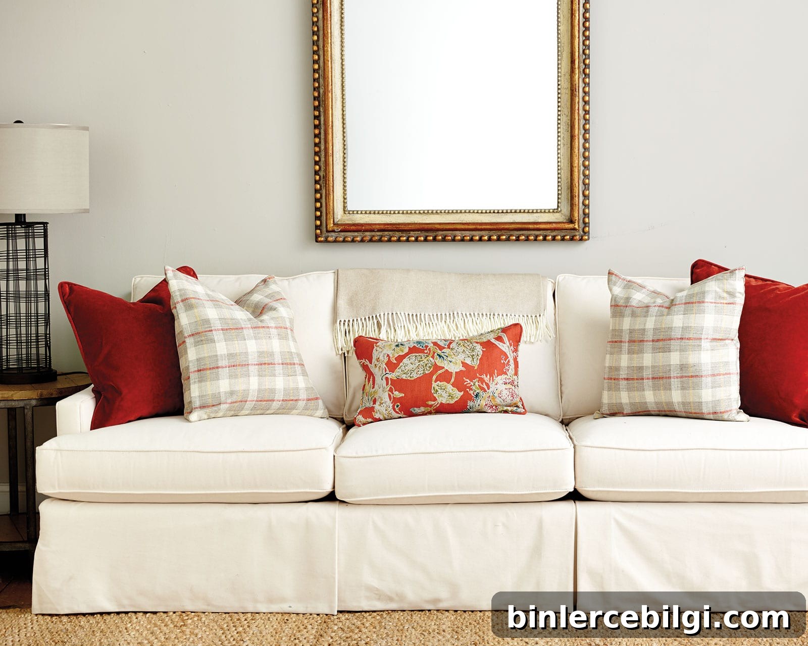 cream colored couch with multiple throw pillow sizes