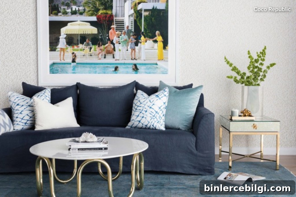 blue couch sitting in a living room with multi colored square throw pillows on it