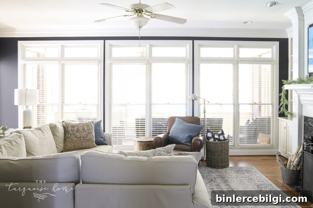 Where to Buy and How to Install an Extra-Long Curtain Rod 2 Hale Navy Walls and a Wall of windows without curtains.