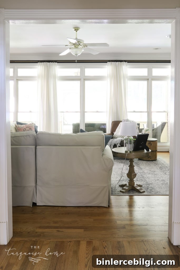 Cozy Navy Blue Living Room Reveal and Decor Ideas 11 Living Room with a wall of windows