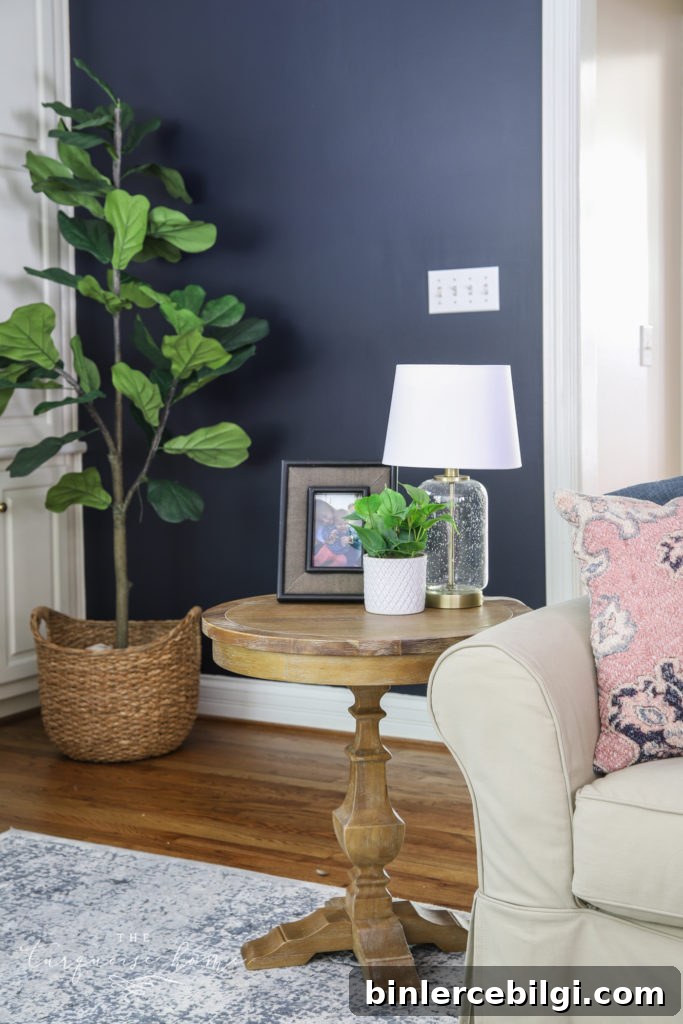 End Table Decor with a framed picture, potted plant and glass table lamp