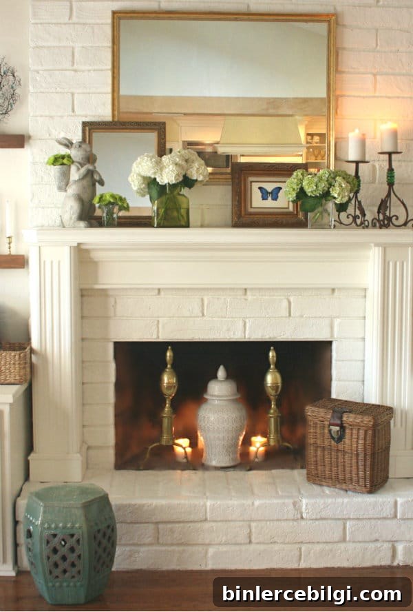 a mix of old and new in spring mantel decor with antique pieces and flower blooms