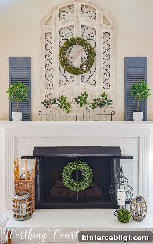 modern farmhouse spring mantel design with boxwood wreaths and other greenery