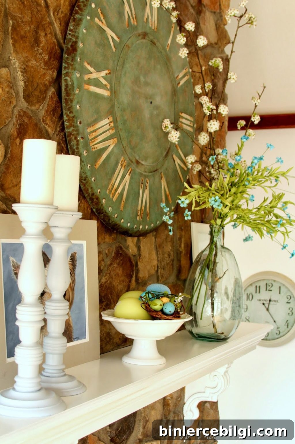 spring mantel design with candles, bright yellow and blue blooms and colored eggs
