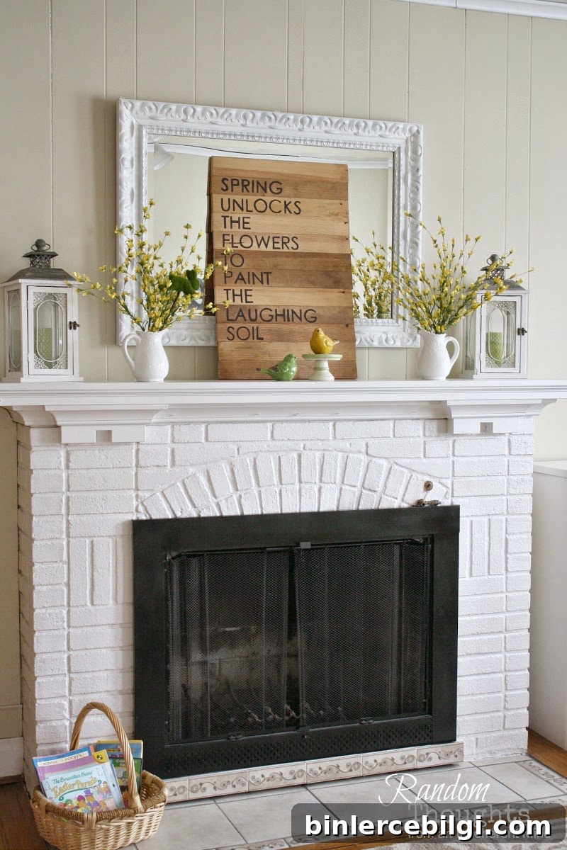 forsythia blooms on a white fireplace mantel with a sign and bird figurines