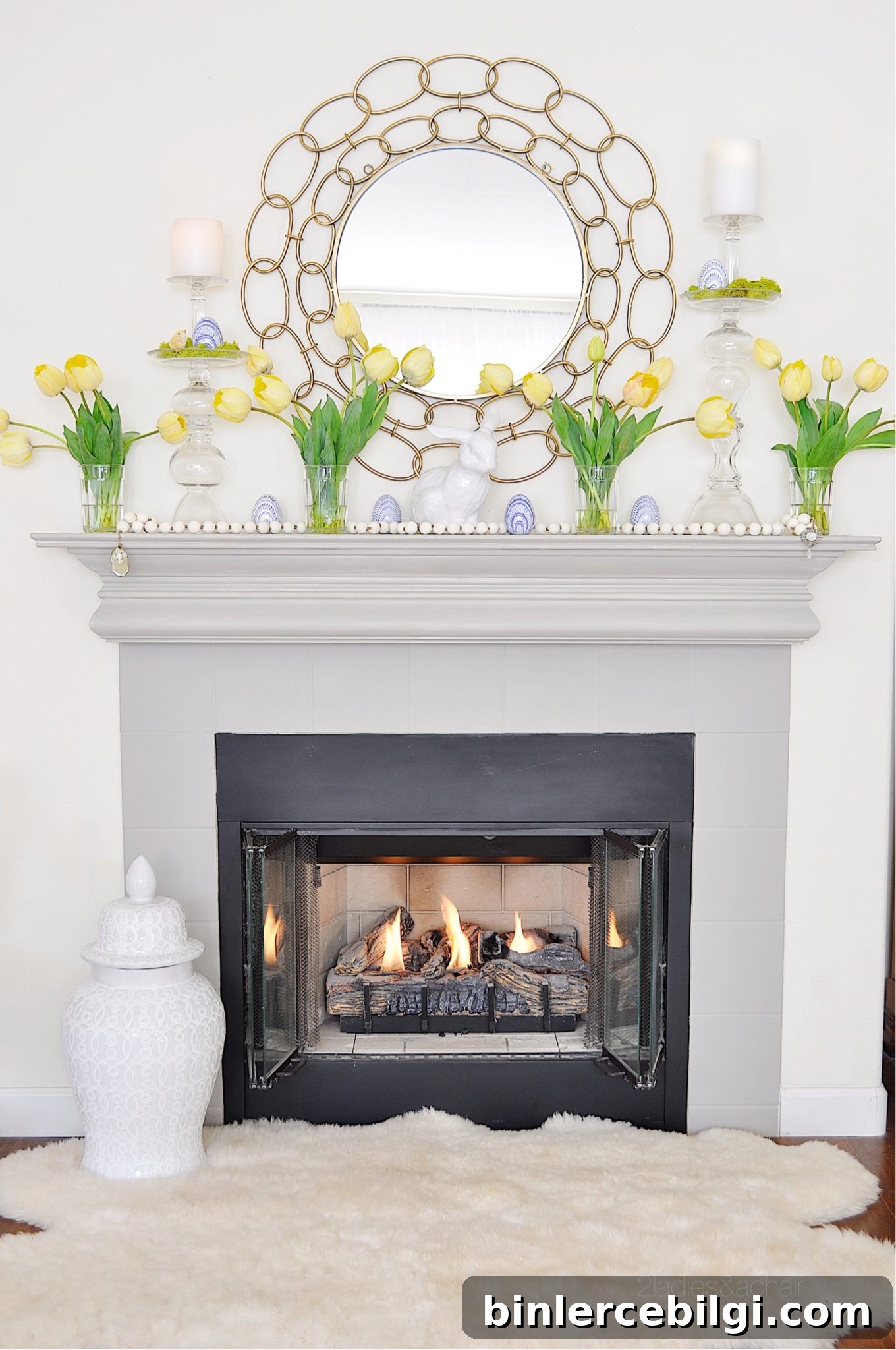lovely springtime mantel decorations with yellow tulips and a circle mirror