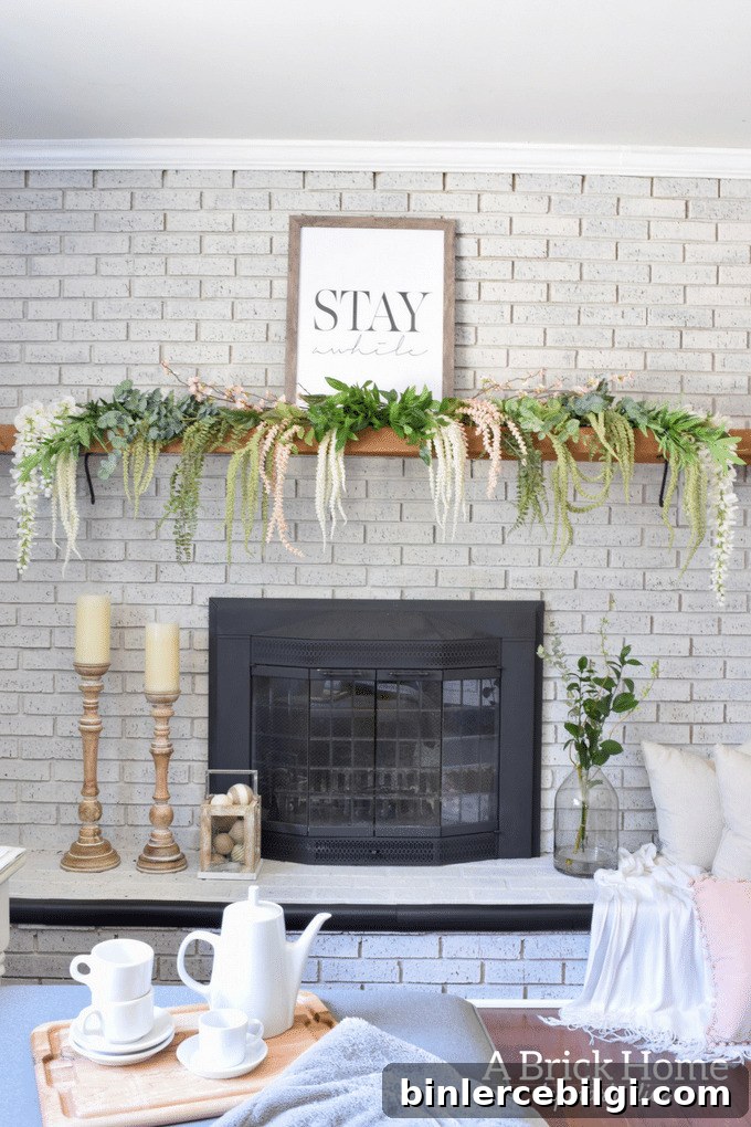 spring fireplace mantel with cascading greenery