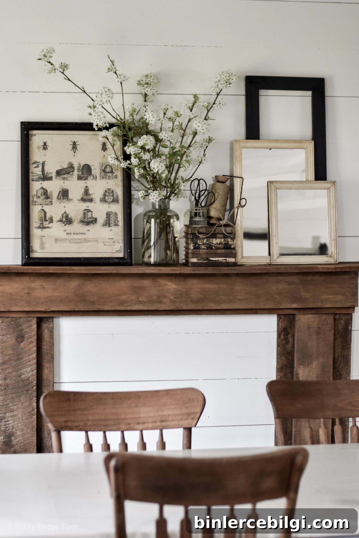 Vintage fireplace mantel decorations with layered mirrors and other vintage pieces