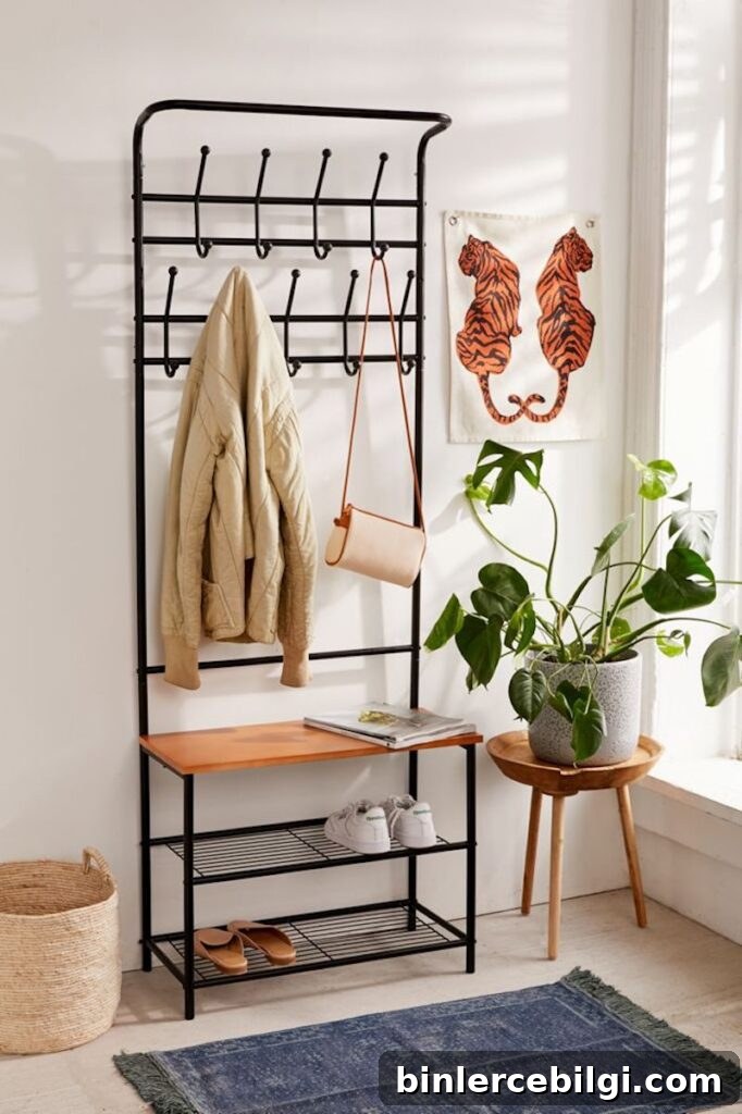 15 Clever Entryway Storage Ideas for Small Spaces 19 All-in-one entryway storage rack, styled with a plant and art.