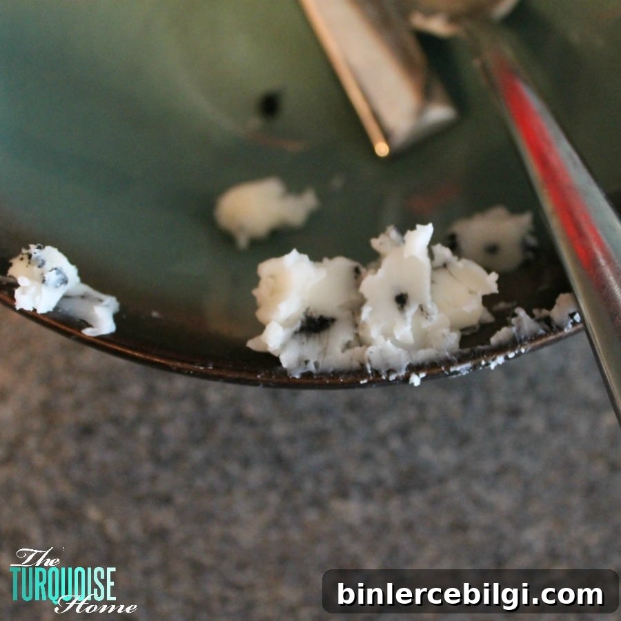 Remove all of the old burned candle pieces
