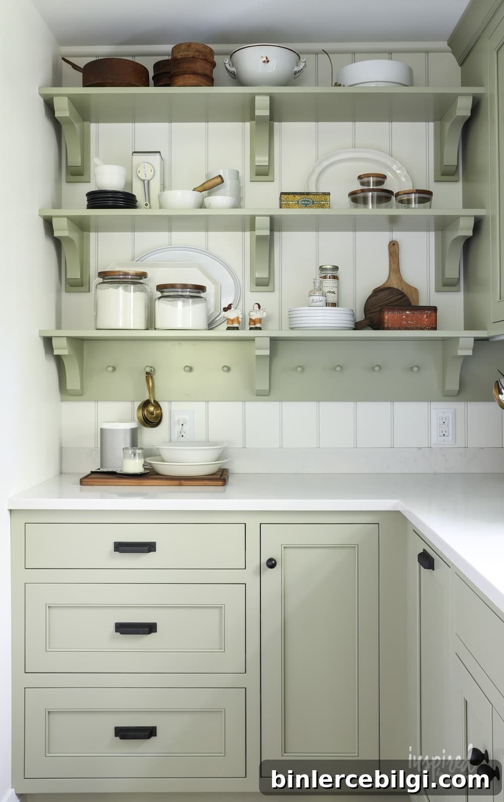 Kitchen cabinets painted Sage by Sherwin Williams