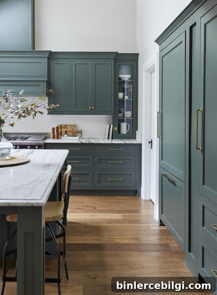 Kitchen cabinets in Pewter Green with gold hardware