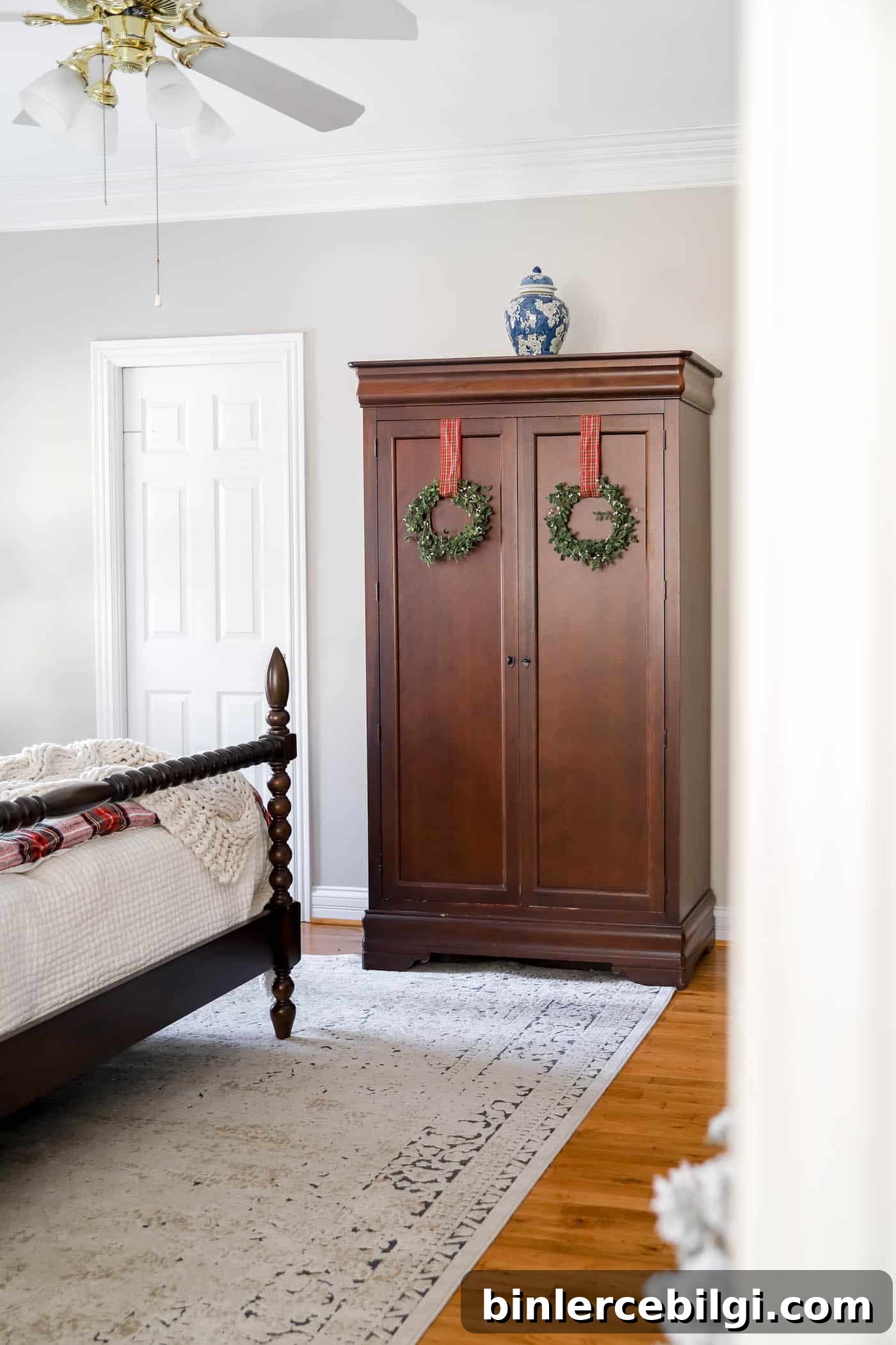 Christmas Bedroom Decor Ideas for a Cozy Holiday Retreat 11 Wreaths on the armoire in Christmas bedroom
