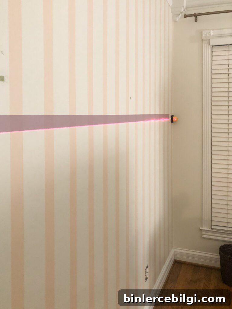 Laser level on striped wall