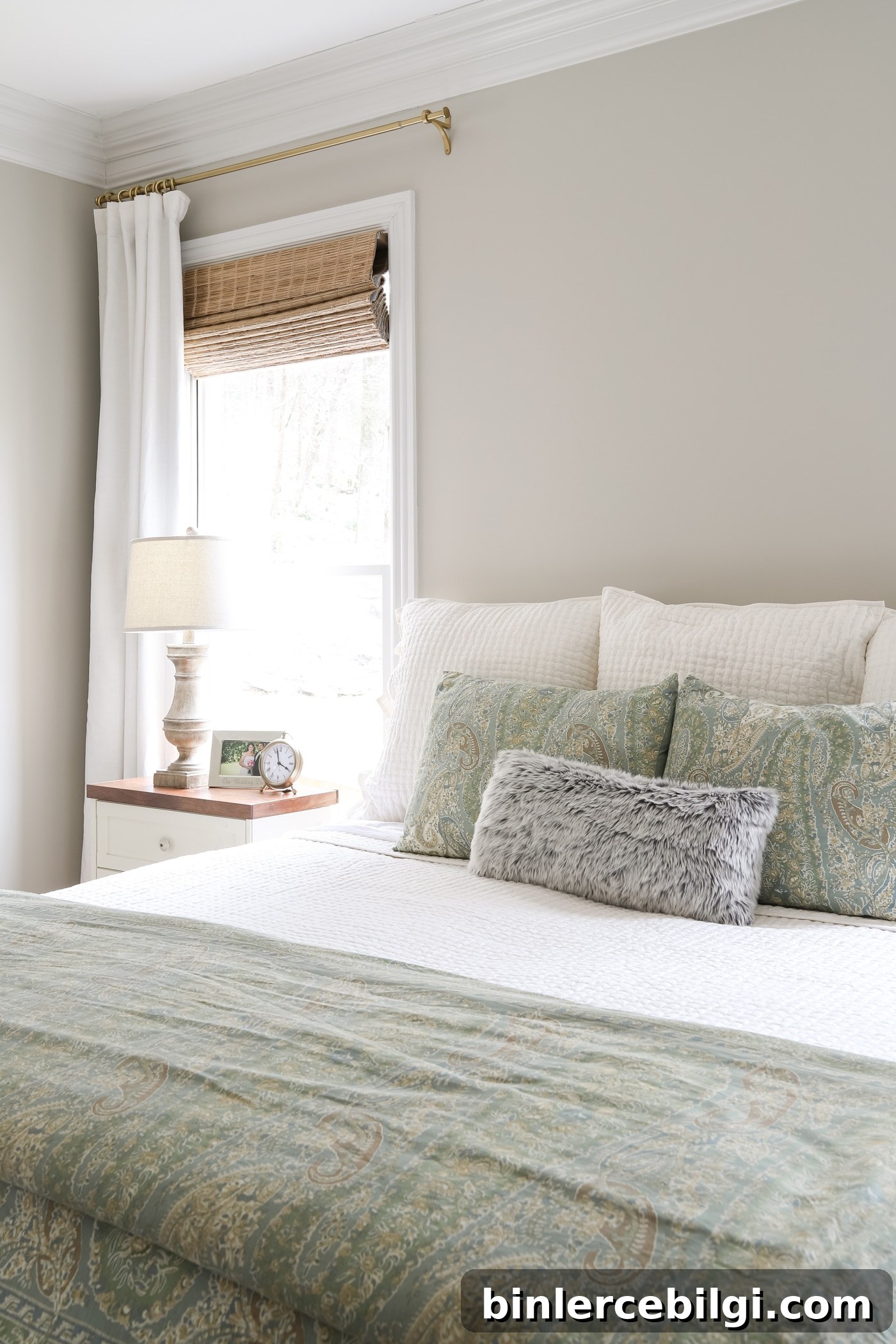 Brass Curtain Rods and Ivory Curtains in the Master Bedroom