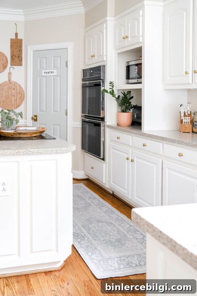 White Kitchen with Blue Rug